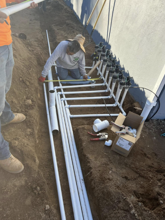 New irrigation valve manifold being installed in a trench